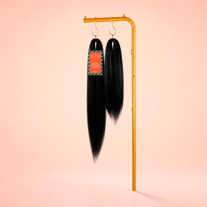 Blhair™ Onyx Noir braid hair in 18-inch and 28-inch lengths displayed on a gold stand.